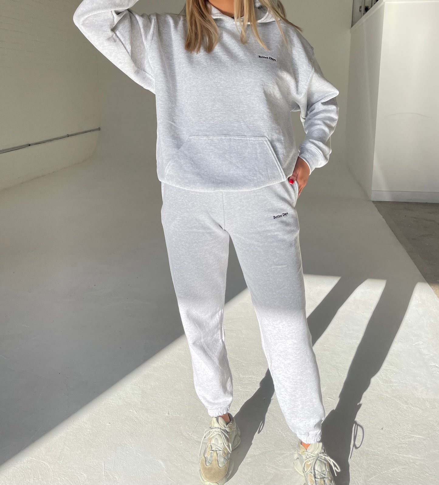 Ash grey hoodie and sweatpants set.